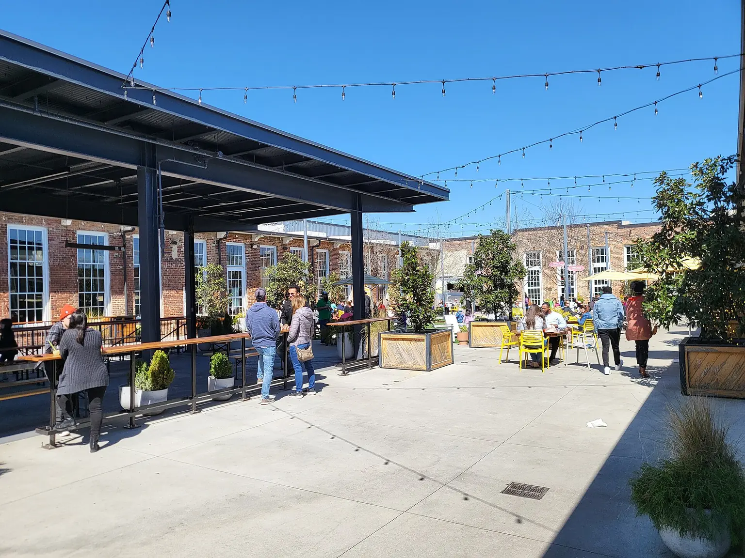 The courtyard at Optimist Hall, a converted mill in Charlotte — Commercial upfit coordination in Charlotte: What to know